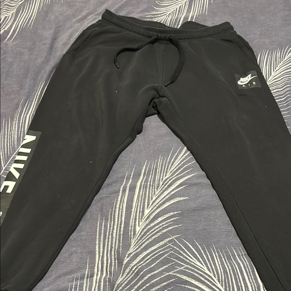 Nike Black Sweatpants with Tapered Fit and Elastic Cuffs